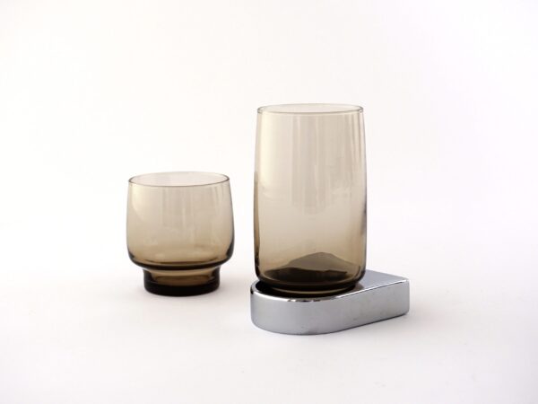 Two glasses with single chrome cup holder and mounting system